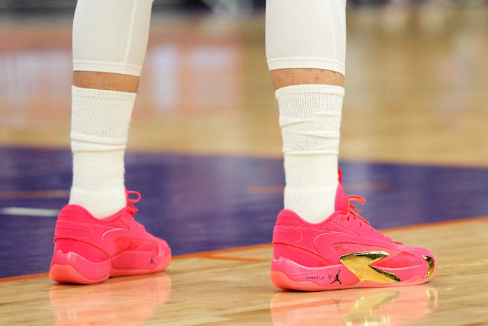 Dallas Mavericks guard Luka Doncic's red and gold Jordan Brand sneakers.